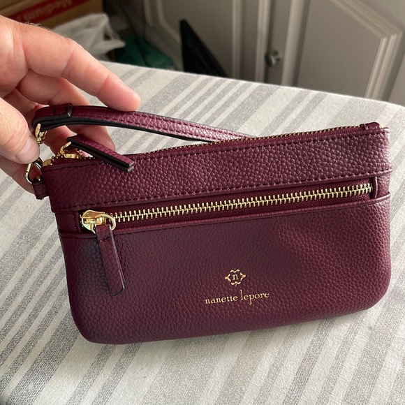 Nanette Lepore Handbags - Nanette Lepore Burgundy Wristlet with Gold Accents